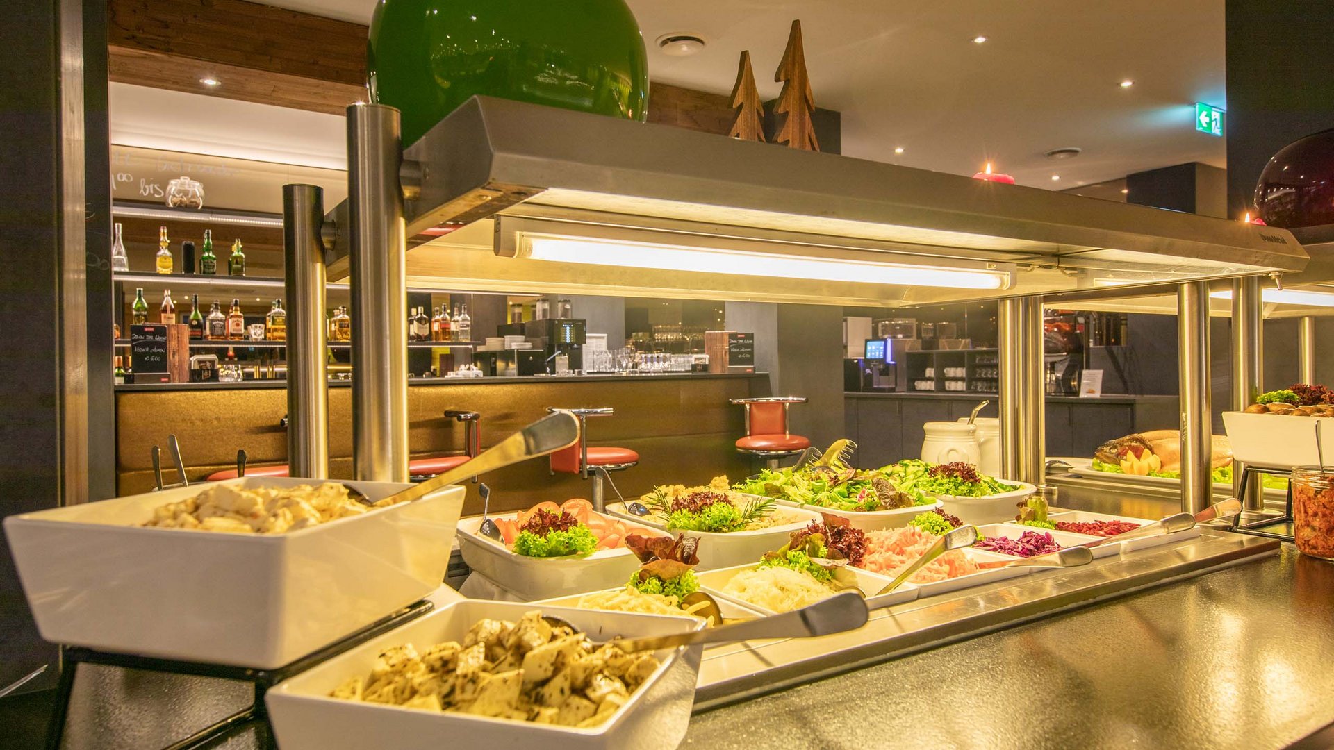 Buffet with salads and various dishes in a restaurant