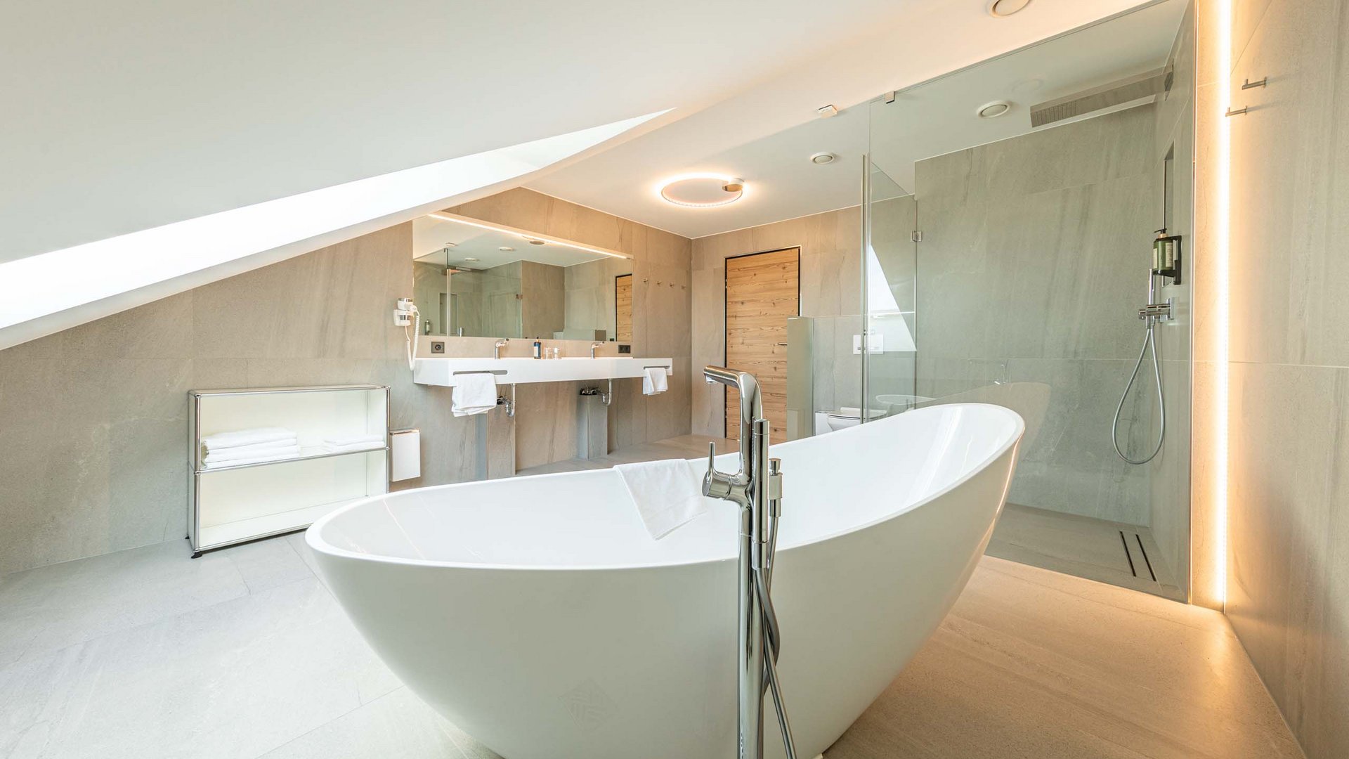 Modern bathroom with freestanding bathtub and walk-in glass shower